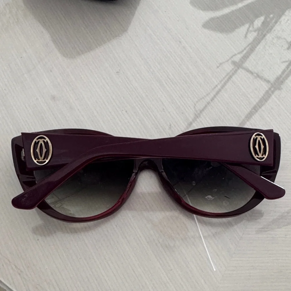 Cartier Burgundy Women's Sunglasses with Gold Emblem